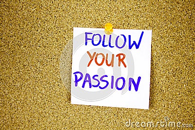 follow your passion on Sticky note with inscription pinned on a cork bulletin board Stock Photo