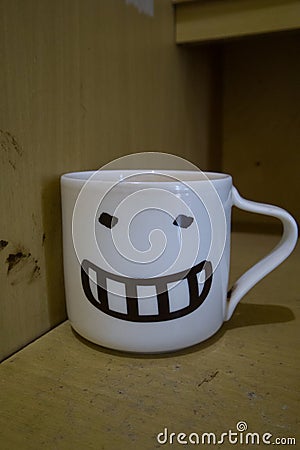 a smiling coffee cup on the table Stock Photo