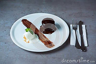 Fondant chocolate with ice ream served in dish isolated on grey background top view of bahrain food Stock Photo