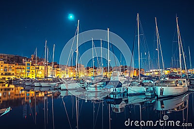 Fontvieille and Monaco Harbor with luxury yachts port, French Riviera night view. Travel concept Editorial Stock Photo