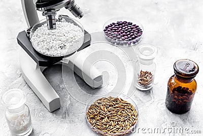 Food analysis. Rice under the microscope on grey background Stock Photo