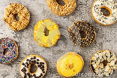 Assortment of donuts on stone background Stock Photo