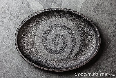Food background. Empty cast iron black plate Stock Photo