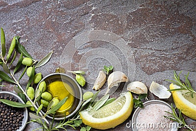 Food Background with Olives, Oil, Lemon, Garlic, Herbs and Spice Stock Photo