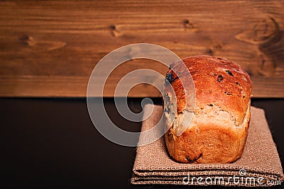 Food background Organic French whole wheat Raisin bread on black background plate Stock Photo