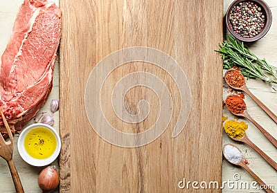 Food background with raw meat steaks and seasoning. Stock Photo