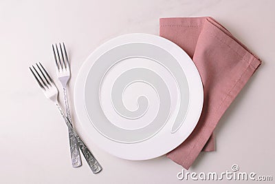 Food background. White empty plate, cutlery, napkin. Top view, c Stock Photo