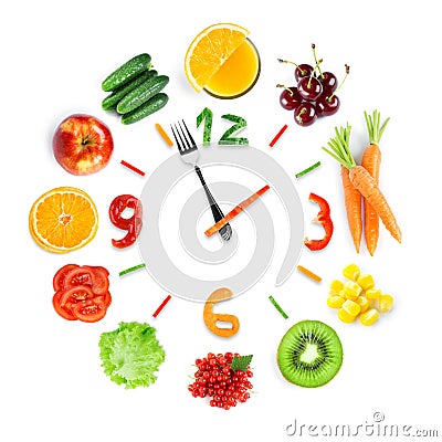 Food clock with fresh fruits and vegetables Stock Photo