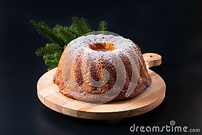 Food Concept homemade Gugelhupf, Guglhupf, Kugelhopf, kouglof bundt yeast cake of Central Europe on black background Stock Photo