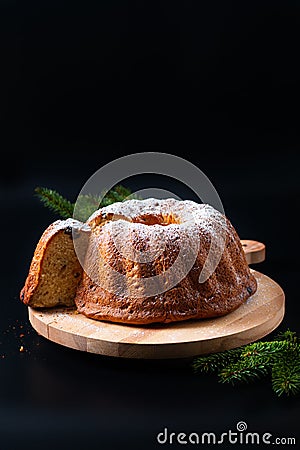 Food Concept homemade Gugelhupf, Guglhupf, Kugelhopf, kouglof bundt yeast cake of Central Europe on black background Stock Photo