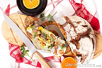 Food concept organic french Sourdough toasted with eggs and ham on wooden cutting board Stock Photo