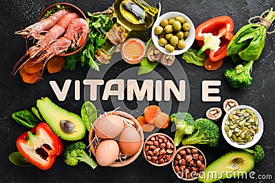 Food containing natural vitamin E: Spinach, parsley, shrimp, pumpkin seeds, eggs, avocados, broccoli. Top view. Stock Photo