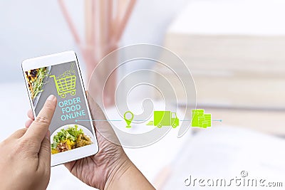 Food delivery service or order food online at home and icon media symbol on touch screen smart phone. Business and technology for Stock Photo