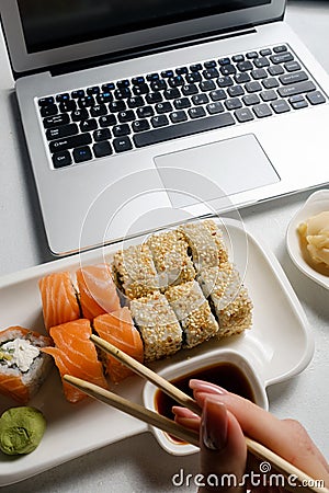 Food delivery service sushi rolls online order Stock Photo