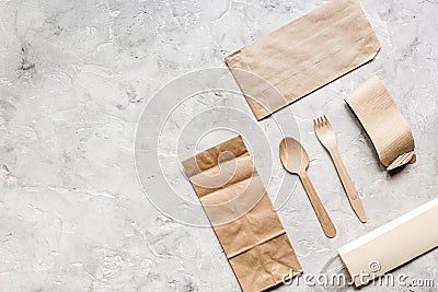 Food delivery workdesk with paper bags and flatware table background top view mock-up Stock Photo