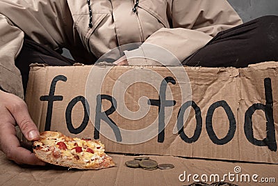 Food donation to beggars.homeless person asking for food Stock Photo