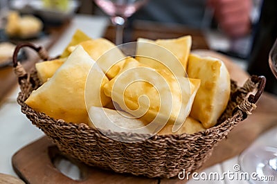 Food of Emilia Romagna region, deep fried bread gnocco fritto or crescentina served in restaurant in Parma, Italy Stock Photo