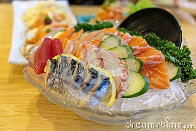 Sashimi mixed fishes such as salmon tuna octopus and crab stick japanese food in restaurant. Stock Photo