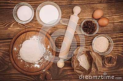 Food ingredients for dough a wooden kitchen board. Cake recipies Stock Photo