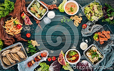 Food in lunch boxes. Delivery of food. Ukrainian cuisine. On a wooden background. Stock Photo