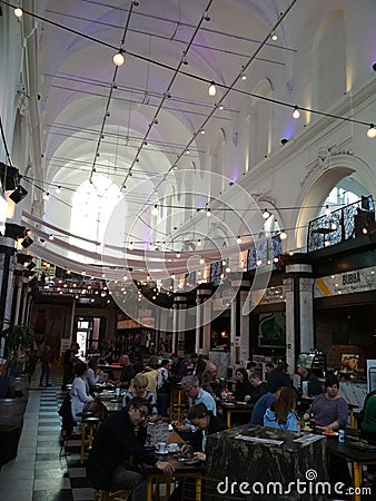 Food market cafe in a church in a town on Gent Editorial Stock Photo