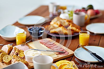 Food on served wooden table at breakfast Stock Photo
