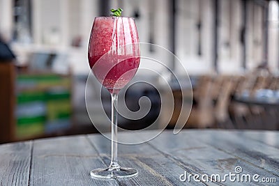 Food shooting. Berry cocktail in crystal glass decorated mint, berries, pomegranate, orange, pineapple. Concept summer drinks, Stock Photo