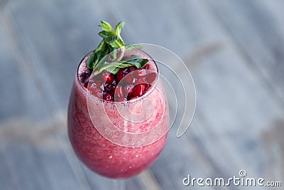 Food shooting. Berry cocktail in crystal glass decorated mint, berries, pomegranate, orange, pineapple. Concept summer drinks, Stock Photo