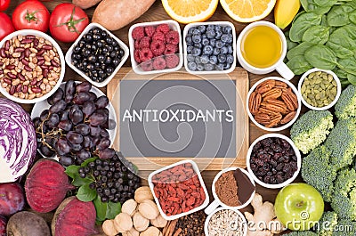 Food sources of natural antioxidants such as fruits, vegetables, nuts and cocoa powder Stock Photo