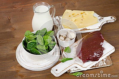 Food sources of vitamin B2 on wooden board. Stock Photo