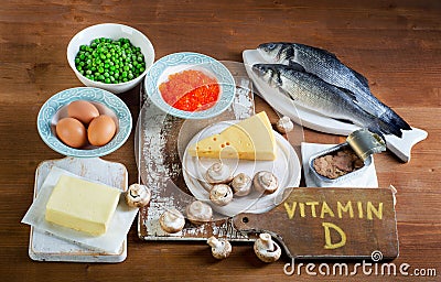 Food sources of vitamin D on a wooden background. Stock Photo