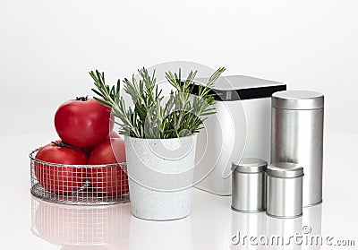 Food storage containers, tomatoes and rosemary Stock Photo