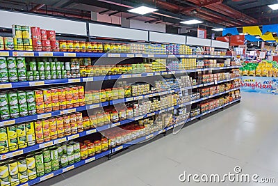 Various tinned foods and vegetables preserved in jars display on shelves in a supermarket, Editorial Stock Photo