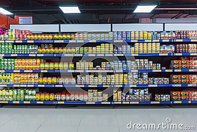 Various tinned foods and vegetables preserved in jars display on shelves in a supermarket, Editorial Stock Photo