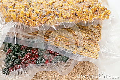food supply.Storage of products in vacuum bags.Stocks of provisions.cereals, pasta,nuts and fruits in bags. rice Stock Photo