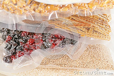 food supply.Vacuuming products for long term storage.Storage of products in vacuum bags.Stocks of provisions.cereals Stock Photo