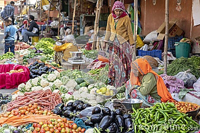 Food trader selling vegetables in street market. Jaipur, Rajasthan, India Editorial Stock Photo