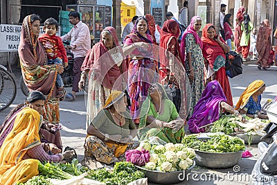 Food trader selling vegetables in street market. Pushkar, Rajasthan, India Editorial Stock Photo