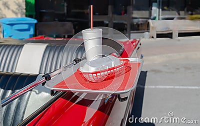 food tray on antique red convertable vintage car Stock Photo