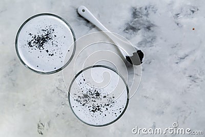 Food trend - charcoal latte on marble background Stock Photo