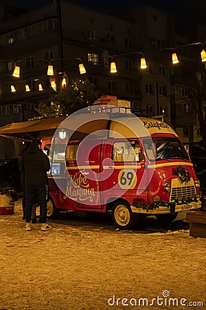 Food truck with hot coffee in winter on a city street, street photo point of view. Krasnoyarsk, Russia - 03 january 2022 Editorial Stock Photo