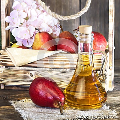 Food, vegetarianism, healthy diet food, drink. Natural juice without pulp from fresh red pear in a glass decanter, wine, liqueur Stock Photo