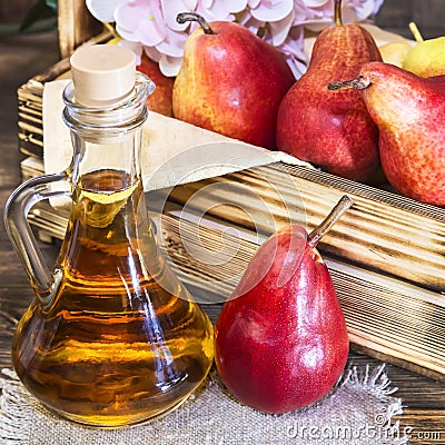 Food, vegetarianism, healthy diet food, drink. Natural juice without pulp from fresh red pear in a glass decanter, wine, liqueur Stock Photo