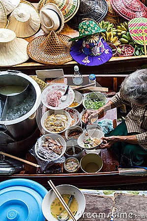 Food vendor at Damnoen Saduak Floating Market, Thailand. Editorial Stock Photo