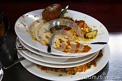 Food wastage, left over food after in a plate after the meal Stock Photo