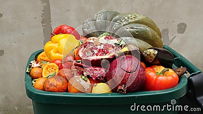 Food Waste in Grocery Store Retail. Discarded unsold damaged fruits and vegetables in packages. Food produced is wasted Stock Photo