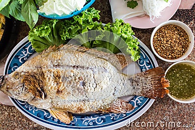 Food wrapped in leaves and Grilled Ruby Fish. Stock Photo