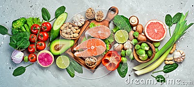 Foods good for the heart: nuts, salmon, avocados, spinach, mushrooms, berries. On a stone background. Stock Photo