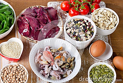 Foods high in Iron, including eggs, nuts, spinach, beans, seafoo Stock Photo