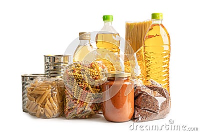 Foodstuff for donation isolated on white background with clipping path, storage and delivery. Various food, pasta, cooking oil and Stock Photo
